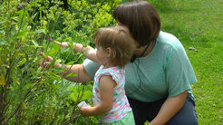 A mother with her child in the garden