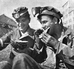 This photograph shows two workers taking a break