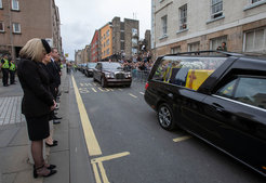 Mourners and onlookers accompany Queen Elizabeth II